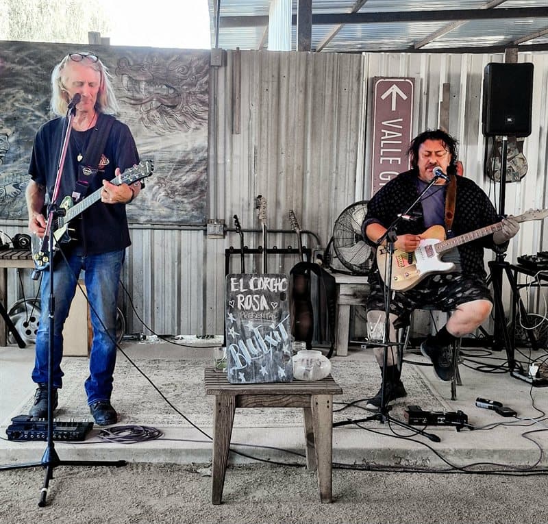 Live music on the stage at El Corcho Rosa